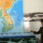 Korean_People’s_Army_soldier_pointing_to_the_DMZ